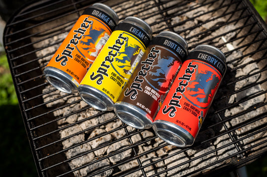 16oz Cans of Sprecher Soda on a grill