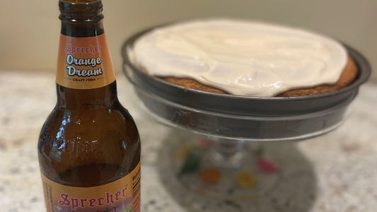 Sprecher Orange Dream Soda next to an Orange Dream Cake