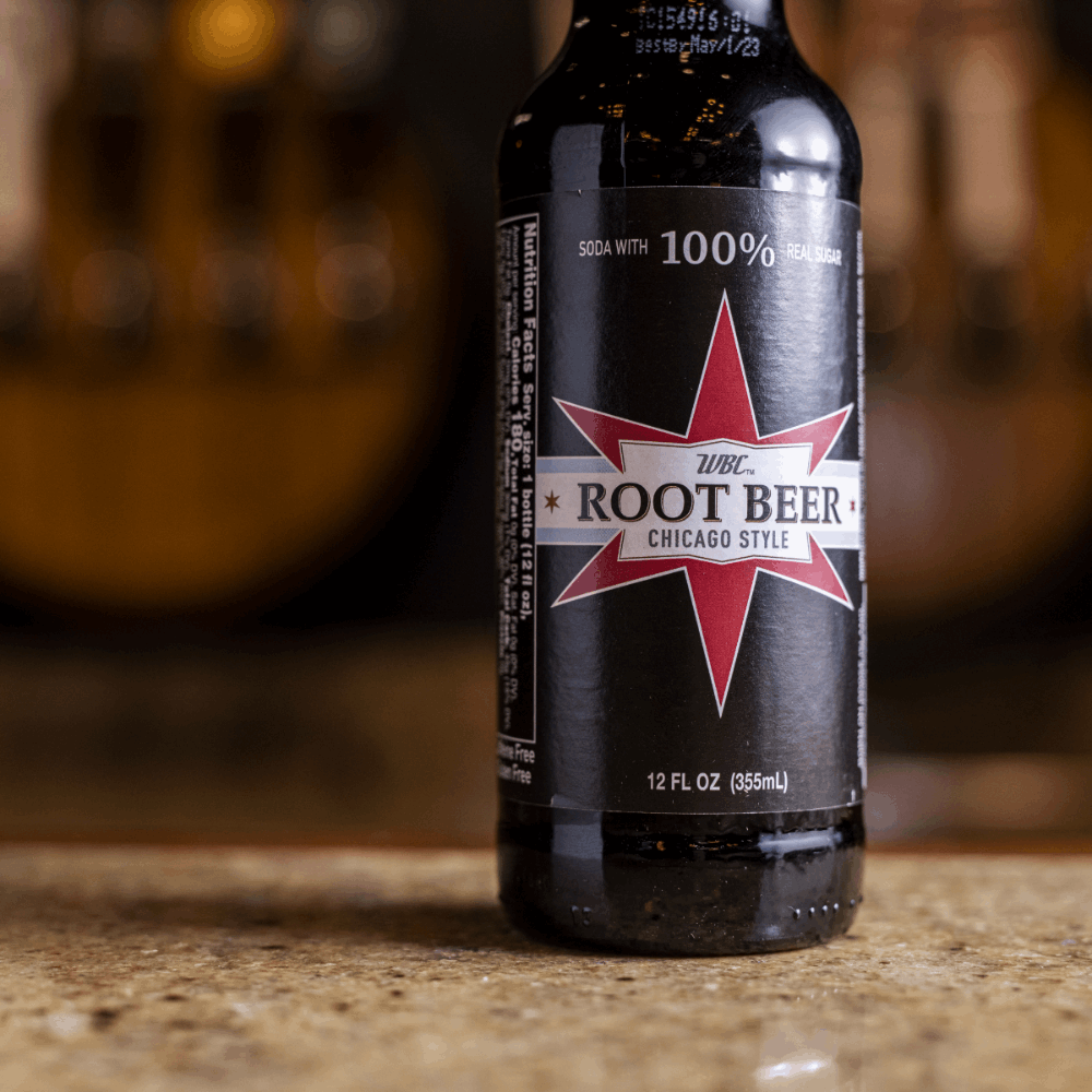 Close up of 12oz WBC Root Beer bottle on a bar