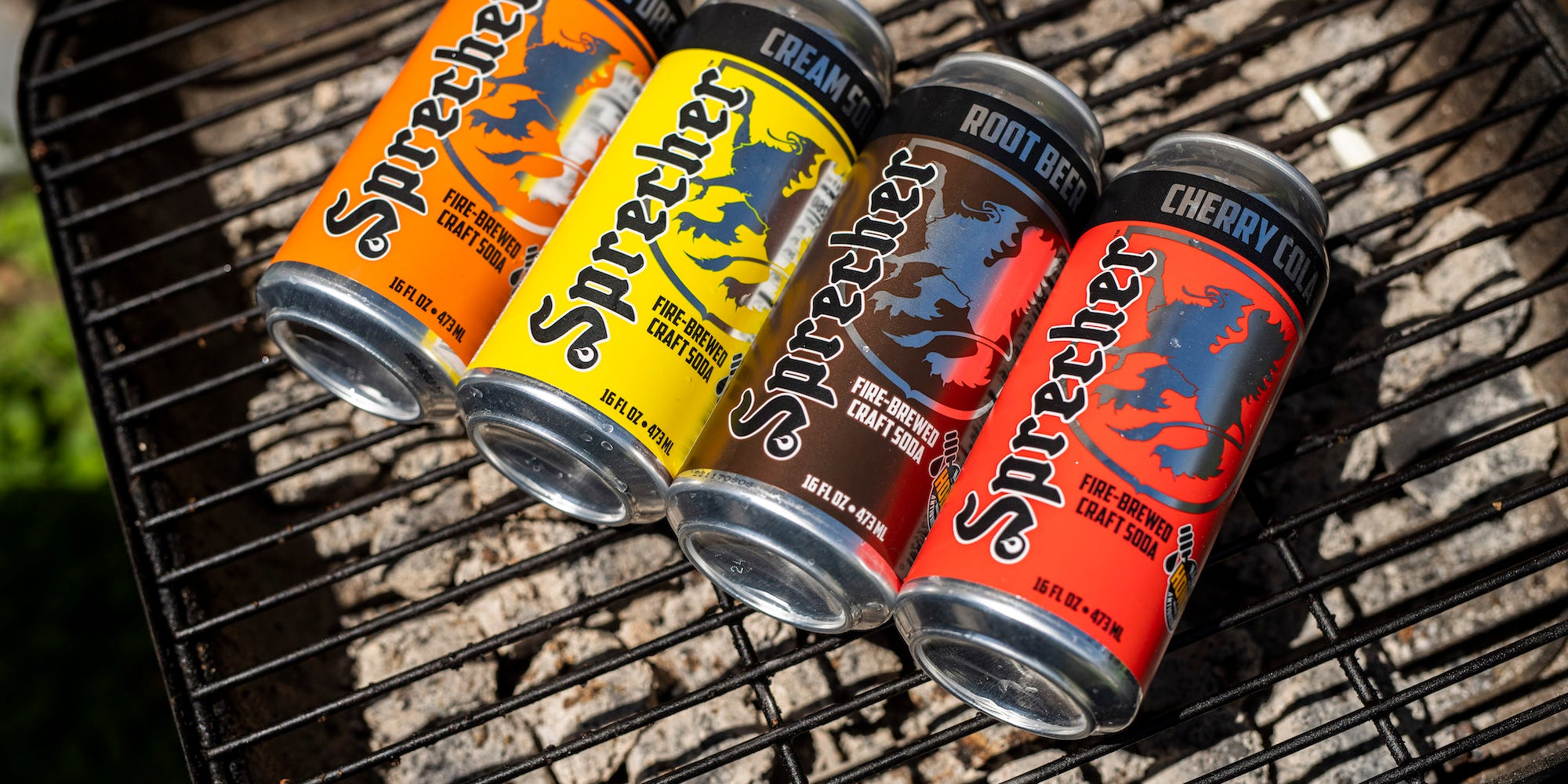 16oz Cans of Sprecher Soda on a grill