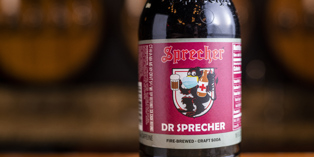 Close up of a bottle of Dr Sprecher sitting on a bar