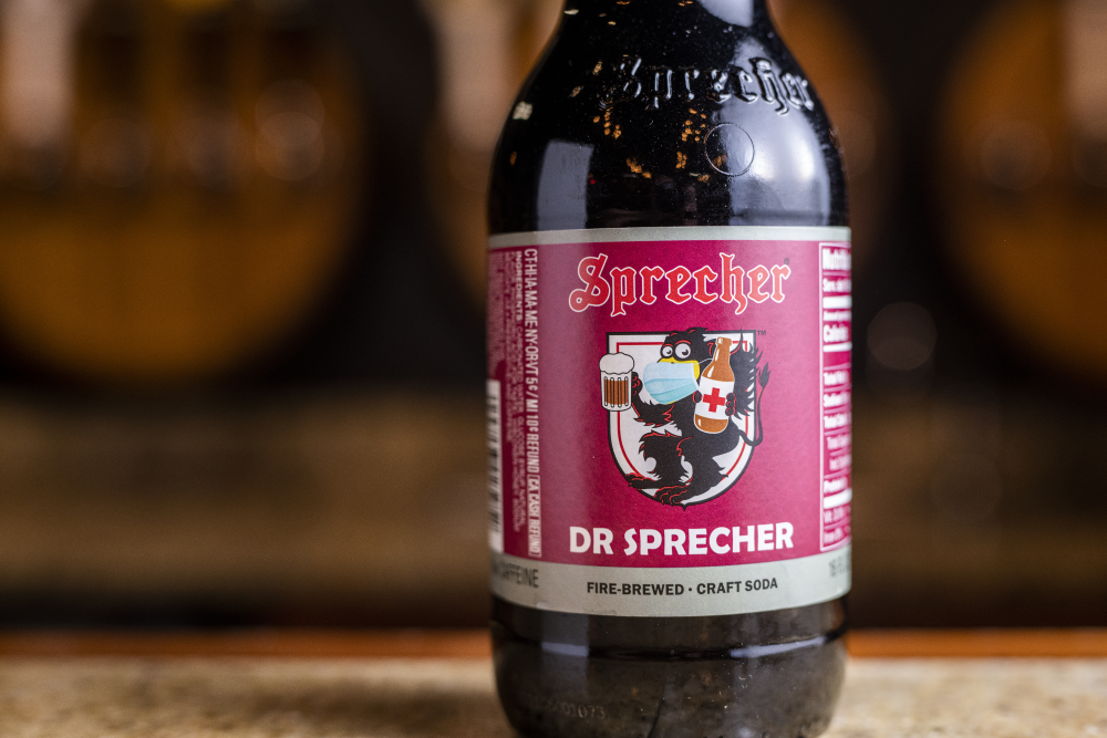 Close up of a bottle of Dr Sprecher sitting on a bar