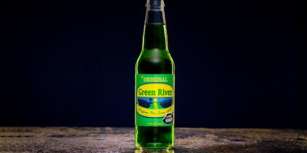 A bottle of green river on a black background