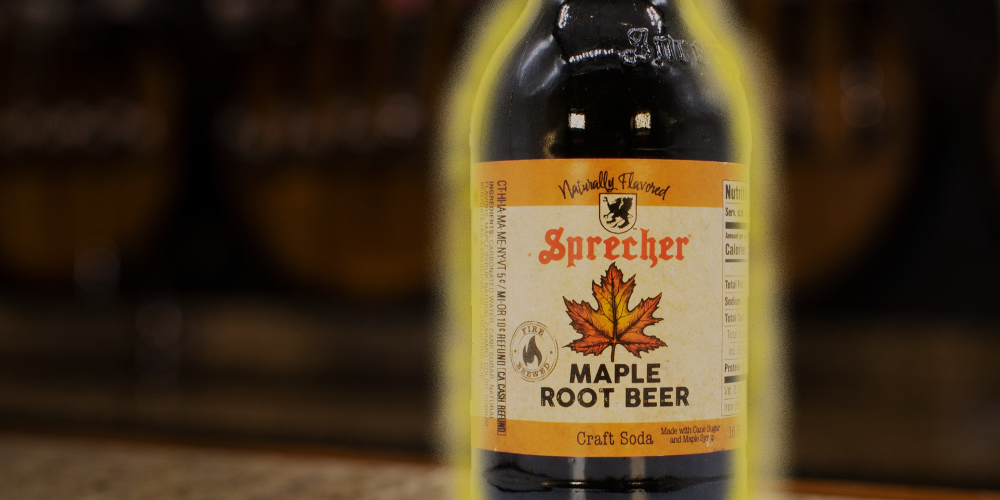 glowing maple root beer bottle on a bar