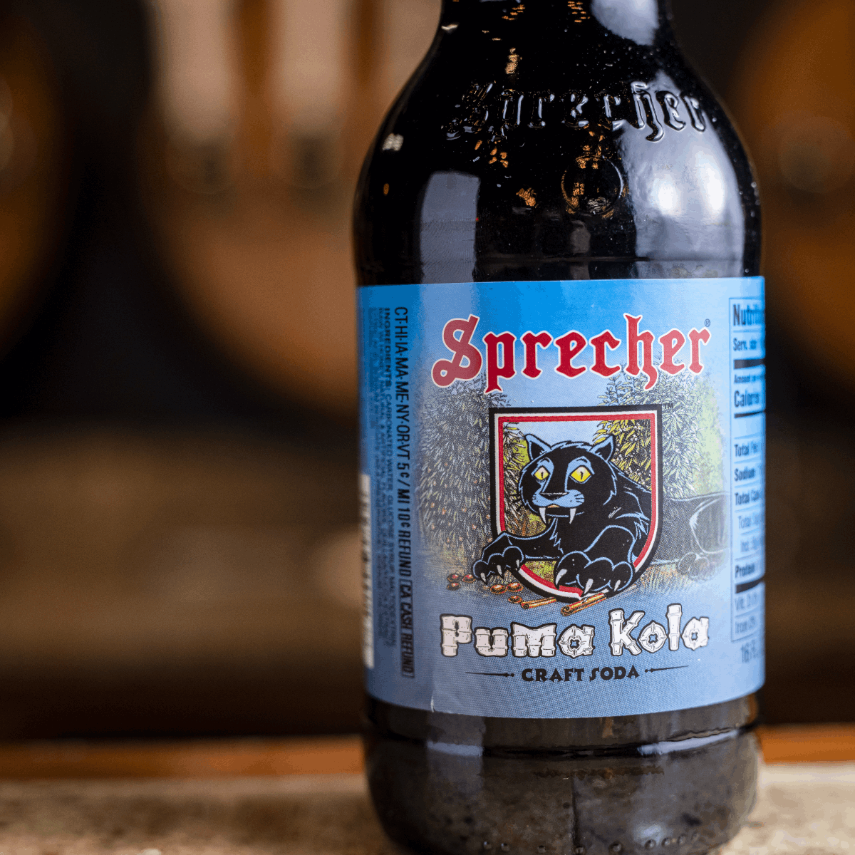 A close up of a 16oz bottle of Sprecher Puma Kola