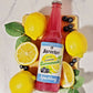 12oz bottle of Sparkling Blueberry Lemonade surrounded by lemons and blueberries