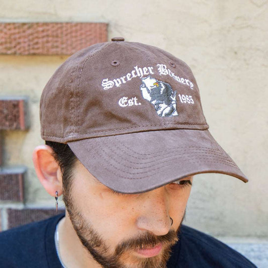 Man wearing a brown Wisconsin Griffin Baseball hat