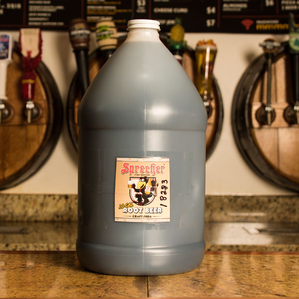 A gallon jug of Sprecher Lo Cal Root Beer Extract on a bar
