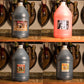 Clockwise from top left: 1 gallon jug of Sprecher Root Beer Extract, Orange Dream extract, Cream Soda extract, Cherry Cola extract